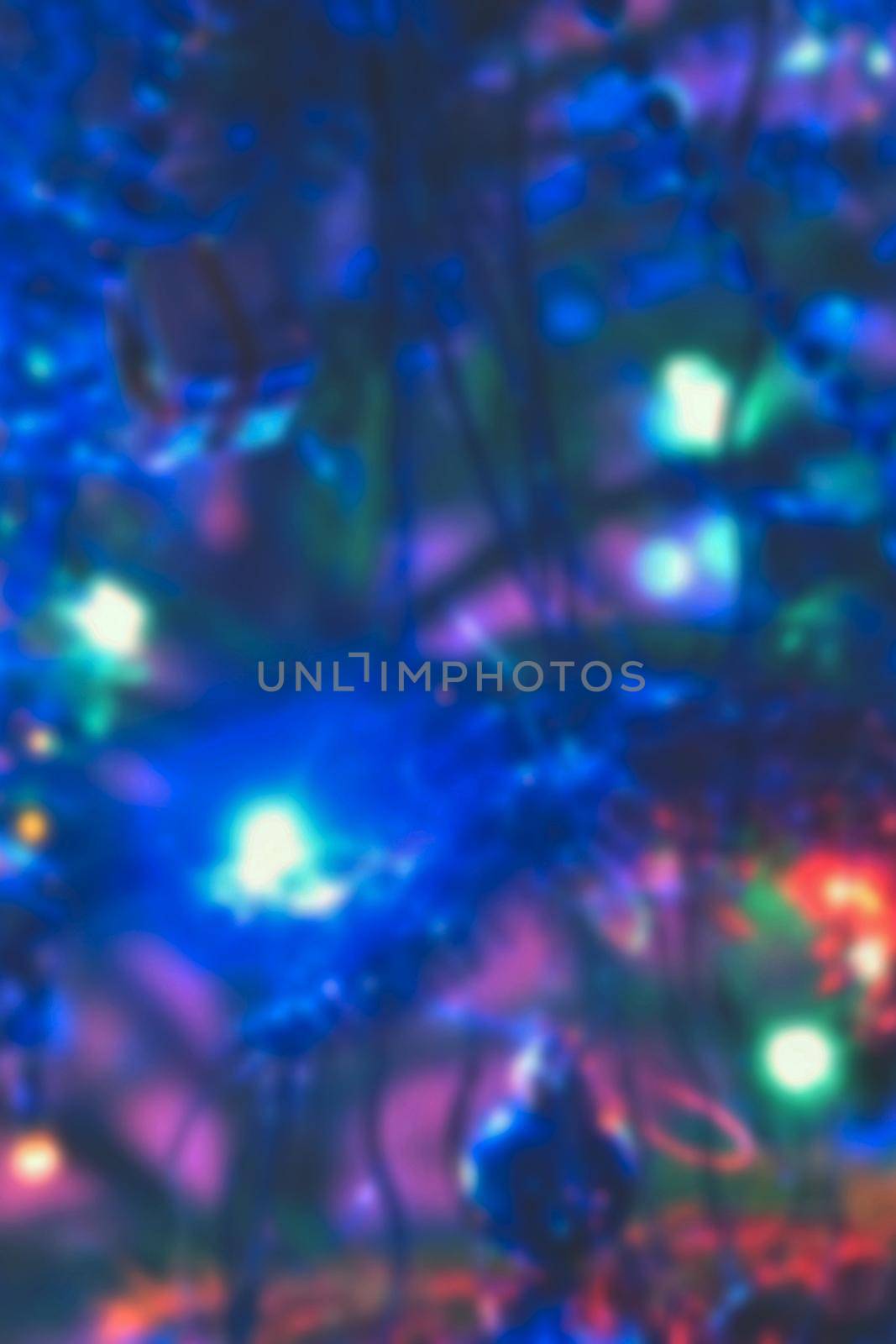 Blurred xmas background, christmas texture and background from color lights.