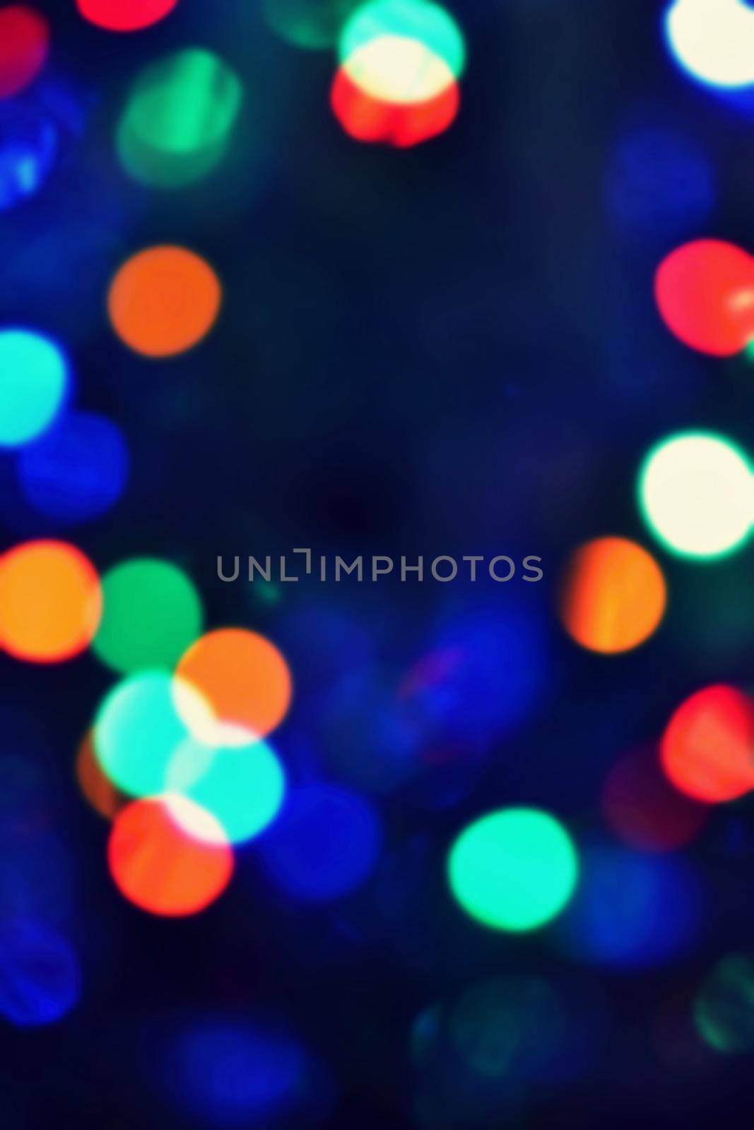 Blurred abstract xmas background, christmas texture from color lights on the Christmas tree. by Montypeter