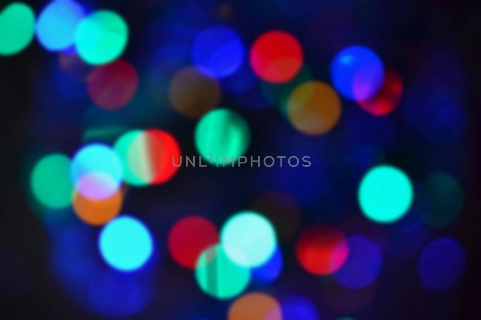 Blurred abstract xmas background, christmas texture from color lights on the Christmas tree. by Montypeter