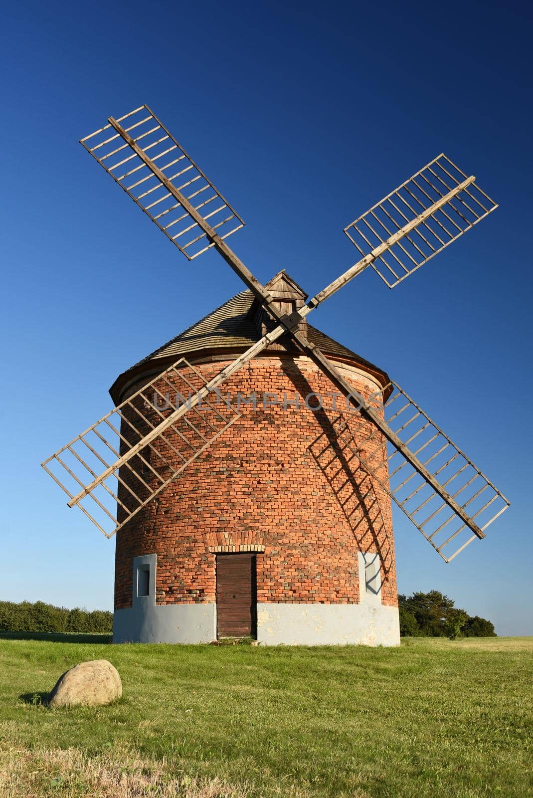 Beautiful old windmill and landscape with the sun. Chvalkovice - Czech Republic. Europe.