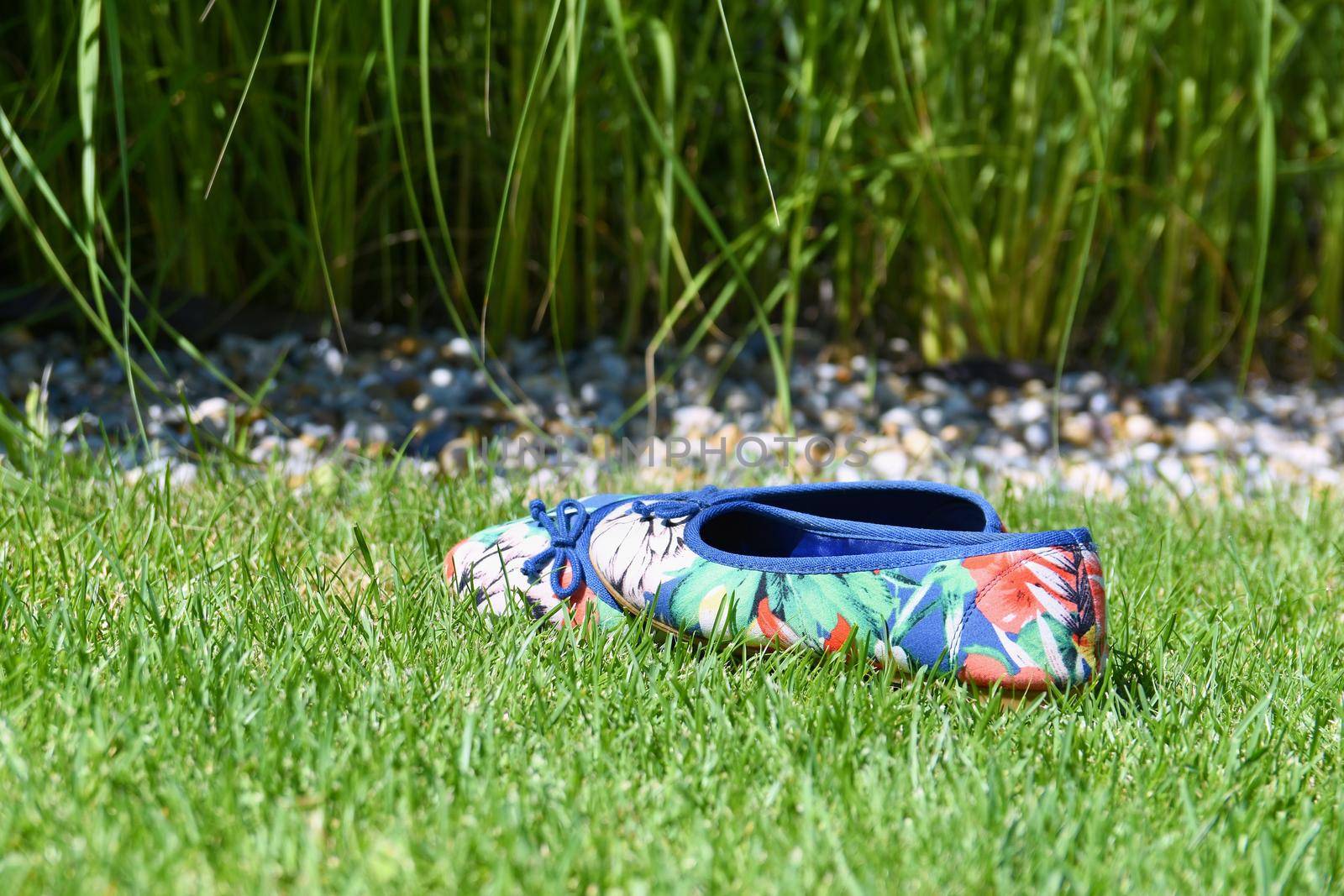 Women 's shoes in the grass.