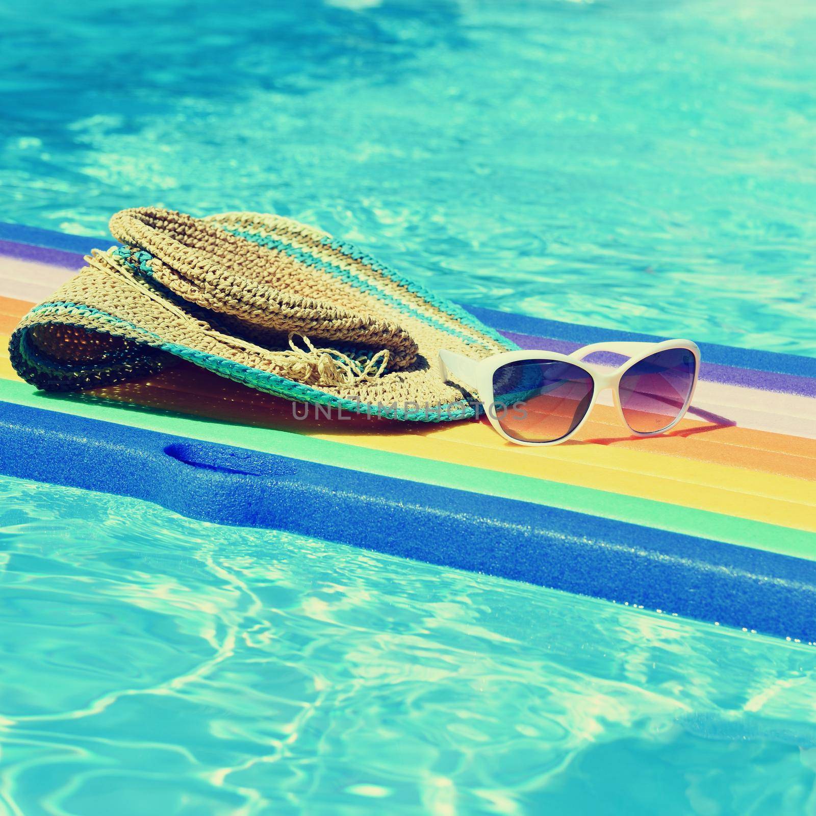 Pool and lounger with clean water. Summer background for traveling and vacation. by Montypeter