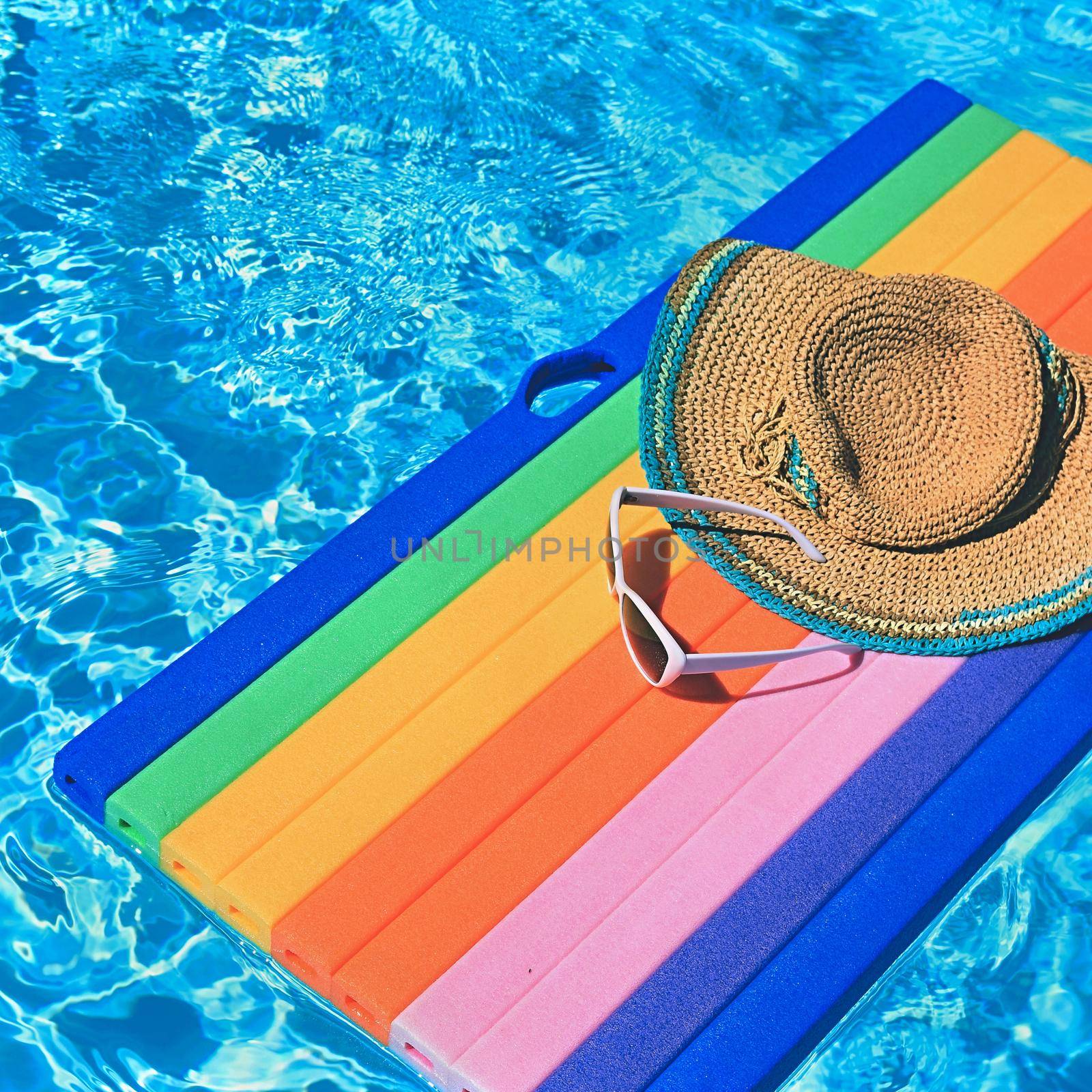 Pool and lounger with clean water. Summer background for traveling and vacation. by Montypeter