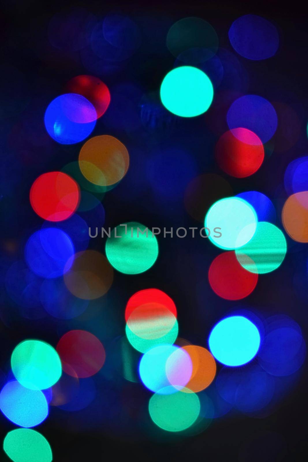 Color Abstract Blurred backgrounds - bokeh. Christmas lights on a pure black background. Preparing for the Holidays.