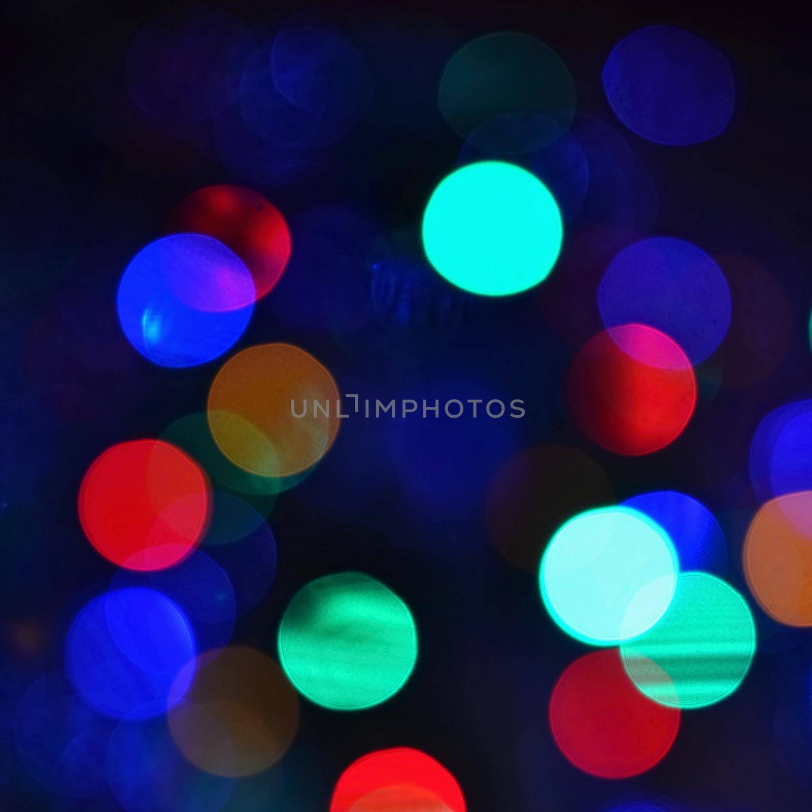 Color Abstract Blurred backgrounds - bokeh. Christmas lights on a pure black background. Preparing for the Holidays.