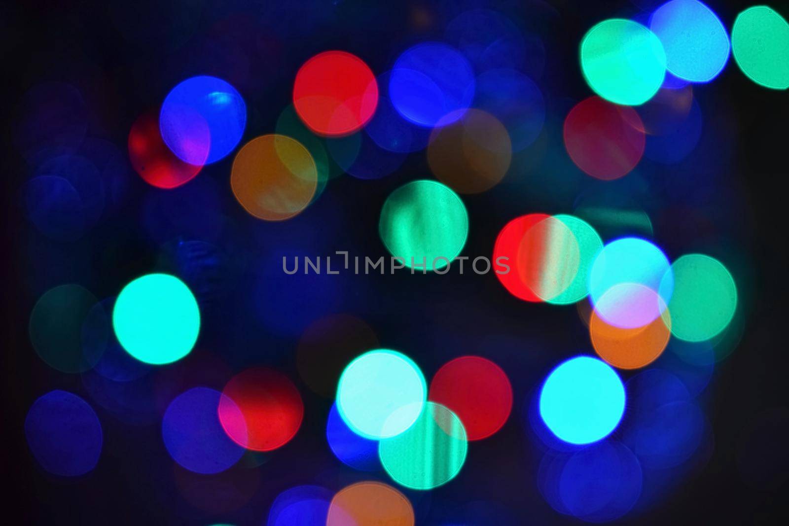 Color Abstract Blurred backgrounds - bokeh. Christmas lights on a pure black background. Preparing for the Holidays. by Montypeter