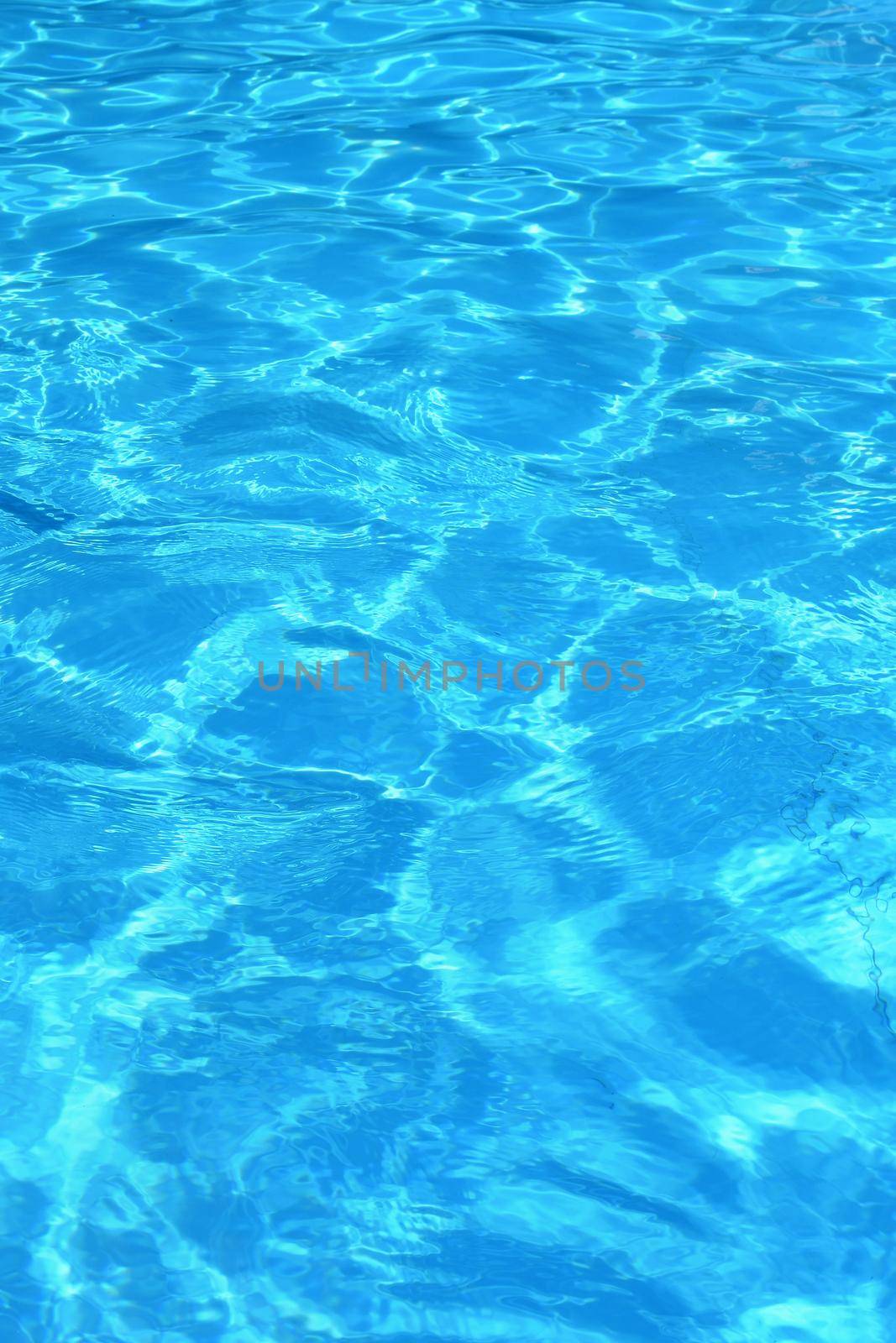 Pool with clean water. Summer background for traveling.