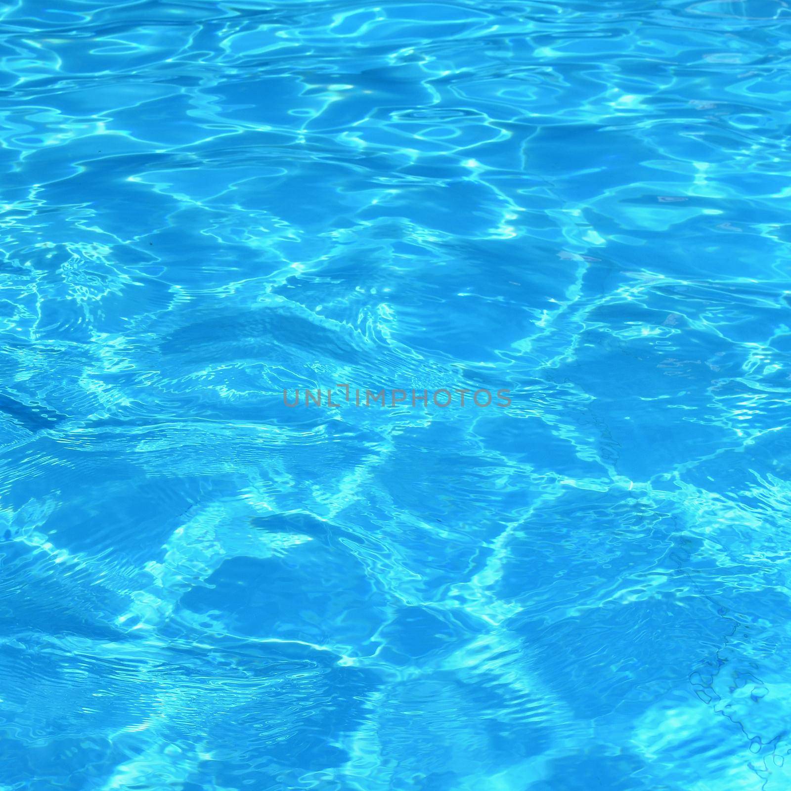 Pool with clean water. Summer background for traveling.