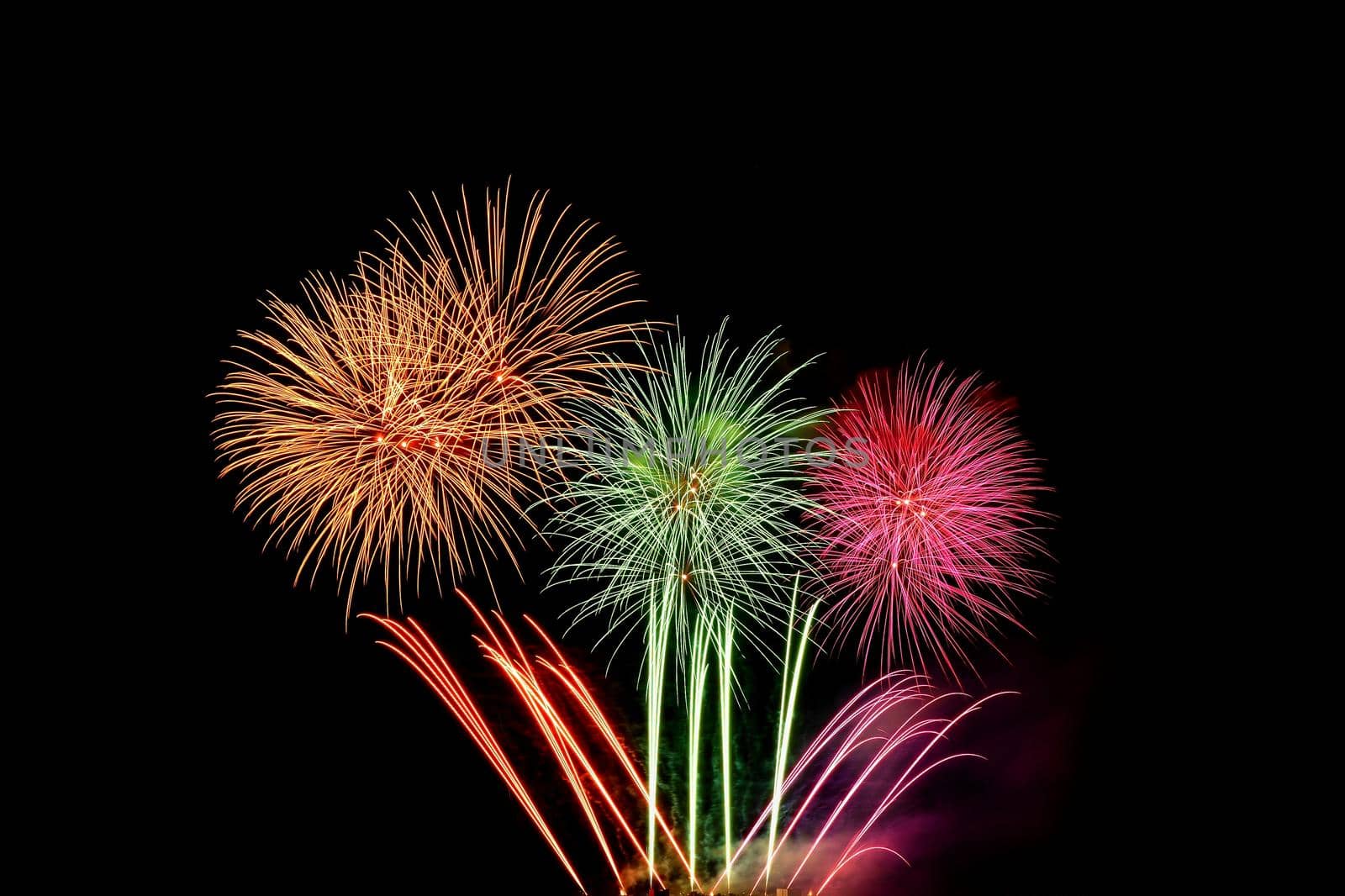 Beautiful colorful fireworks with reflections in water. Brno dam, the city of Brno-Europe. International Fireworks Competition.