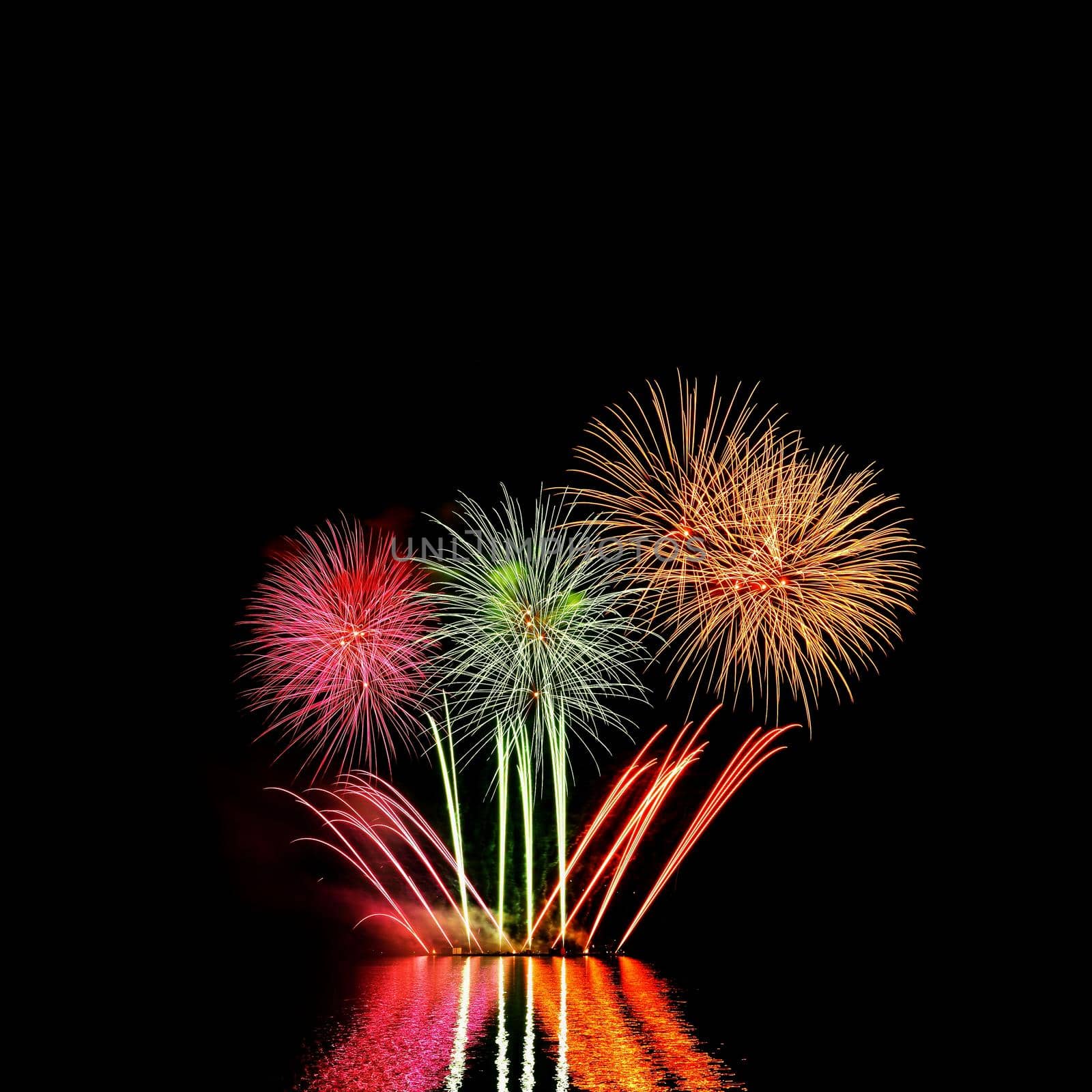 Beautiful colorful fireworks with reflections in water. Brno dam, the city of Brno-Europe. International Fireworks Competition.