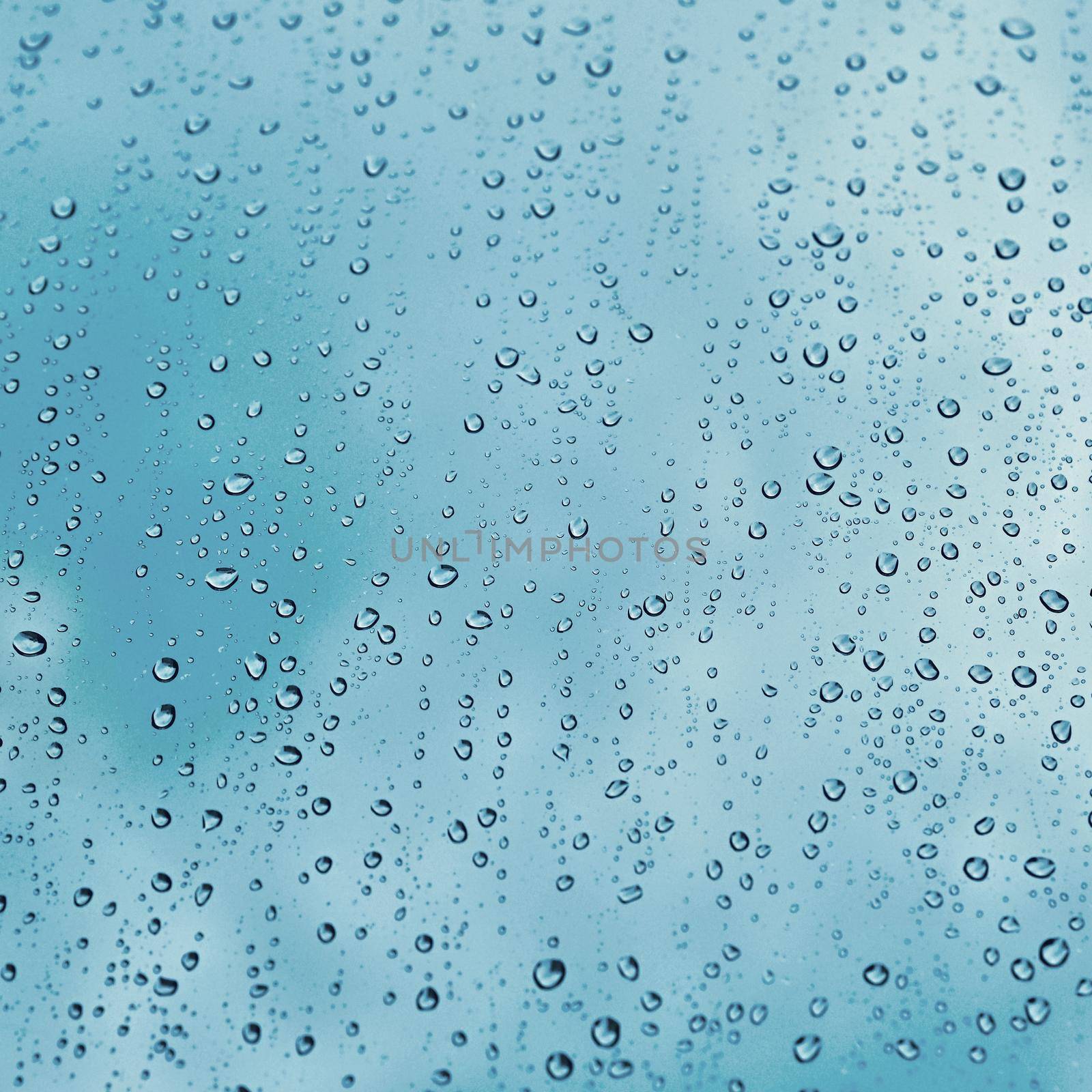 Rain. Autumn seasonal background with rain drops on the window. by Montypeter