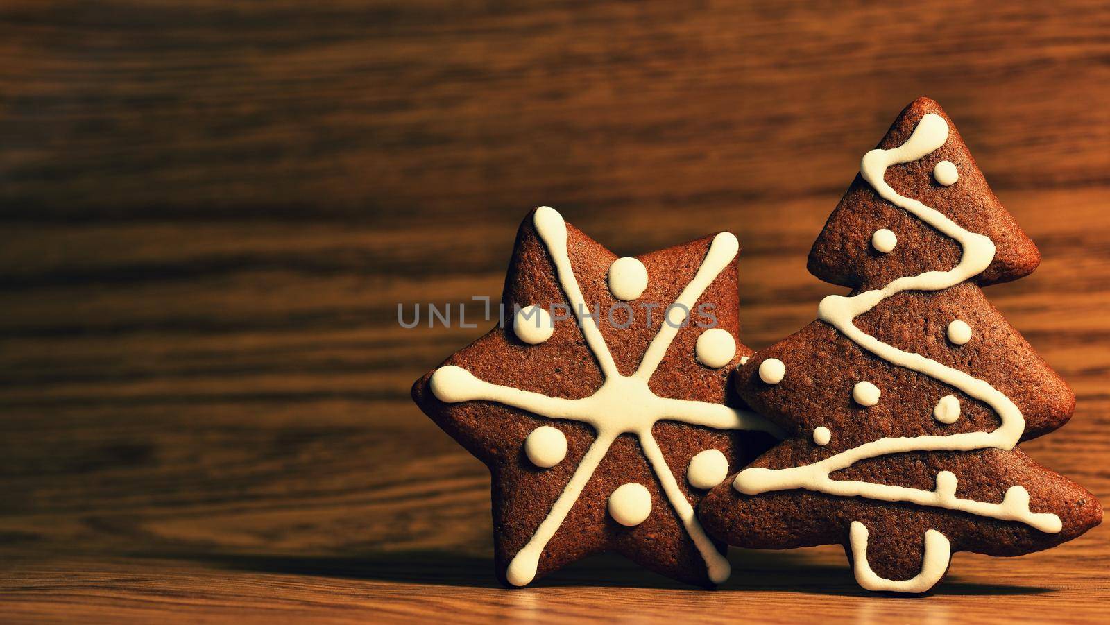 Christmas tree and snowflake. Beautiful sweet Christmas candy. Hand-decorated, homemade gingerbread.