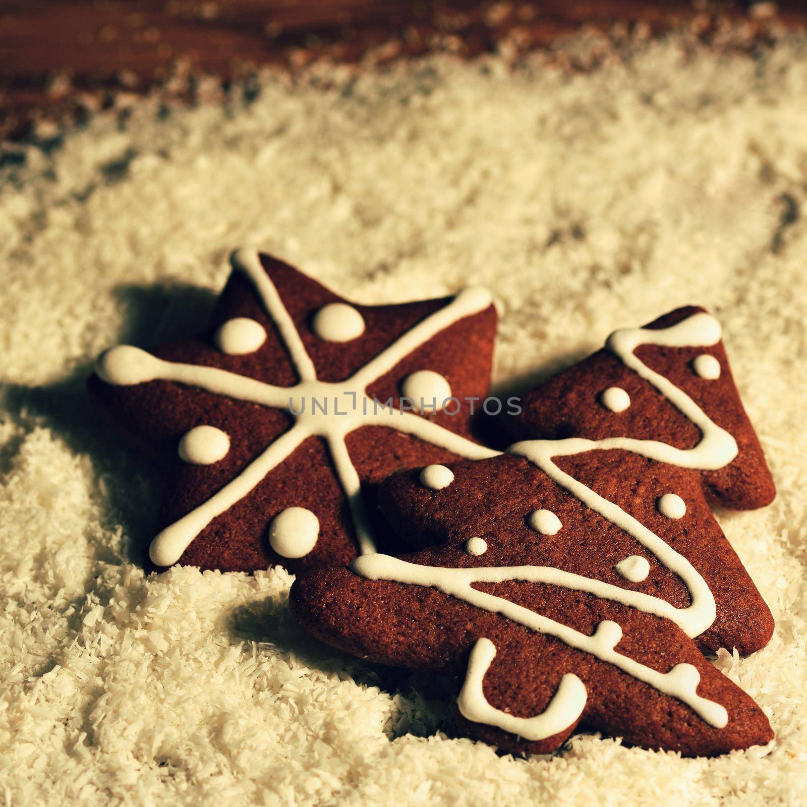 Christmas tree and snowflake. Beautiful sweet Christmas candy. Hand-decorated, homemade gingerbread. by Montypeter