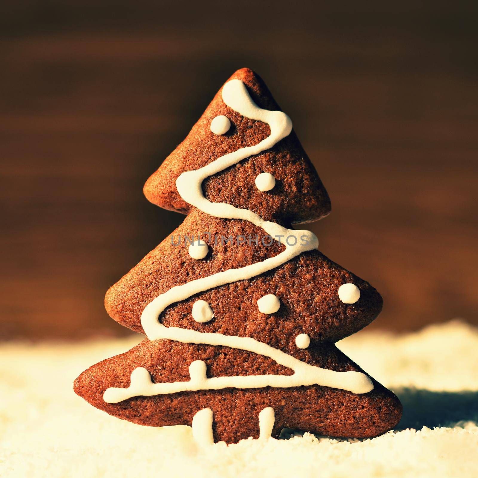 Christmas tree and snowflake. Beautiful sweet Christmas candy. Hand-decorated, homemade gingerbread.