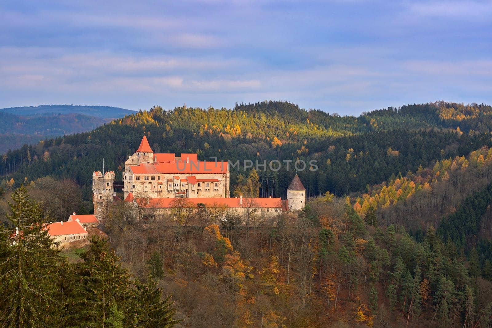 Beautiful old castle in forests with autumn landscape. Castle Pernstejn - Nedvedice. Europe Czech Republic. by Montypeter