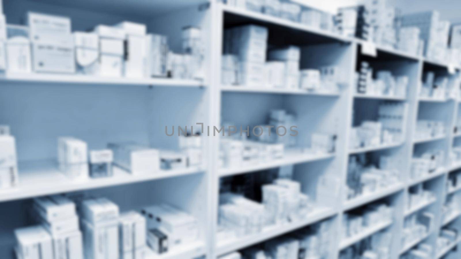 Blurred background. Interior of a pharmacy with goods and showcases. Medicines and vitamins for health. Shop concept, medicine and healthy lifestyle. by Montypeter