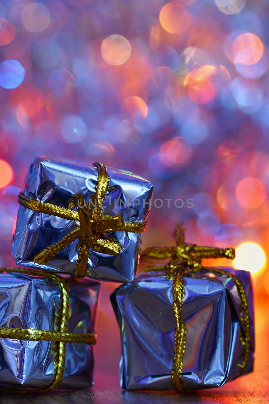 Christmas decorations. Beautiful Christmas tree ornaments on abstract, blurred colorful background. Concept for winter, holiday and snow. by Montypeter