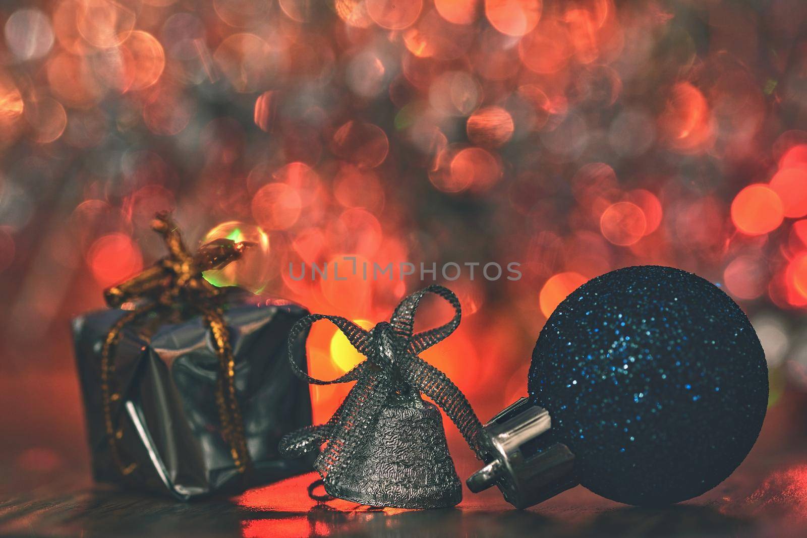 Christmas decorations. Beautiful Christmas tree ornaments on abstract, blurred colorful background. Concept for winter, holiday and snow. by Montypeter