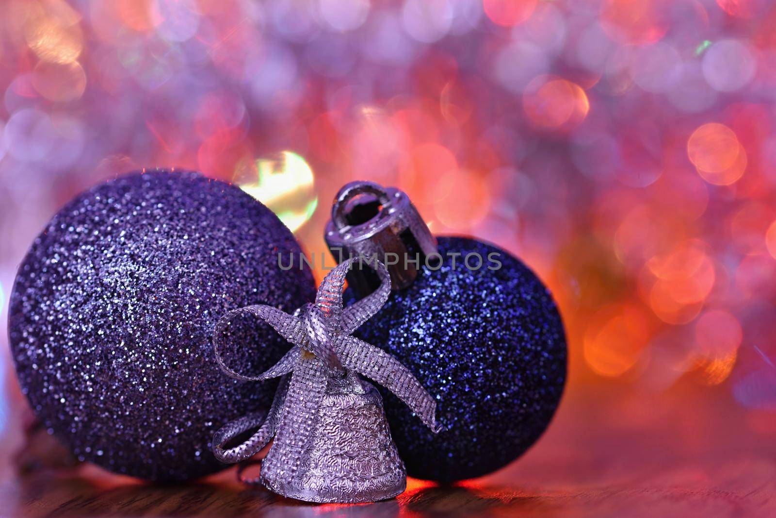 Christmas decorations. Beautiful Christmas tree ornaments on abstract, blurred colorful background. Concept for winter, holiday and snow.