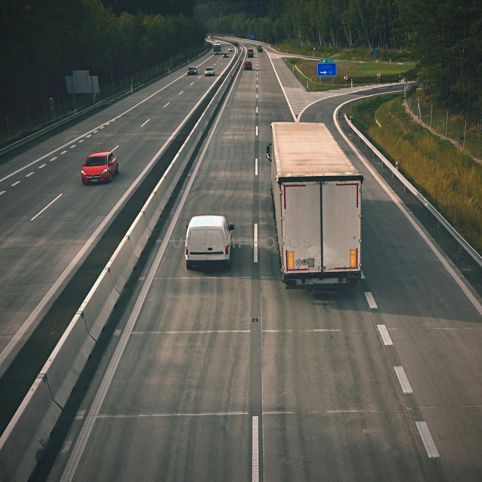 Cars on highway in traffic jam.  by Montypeter