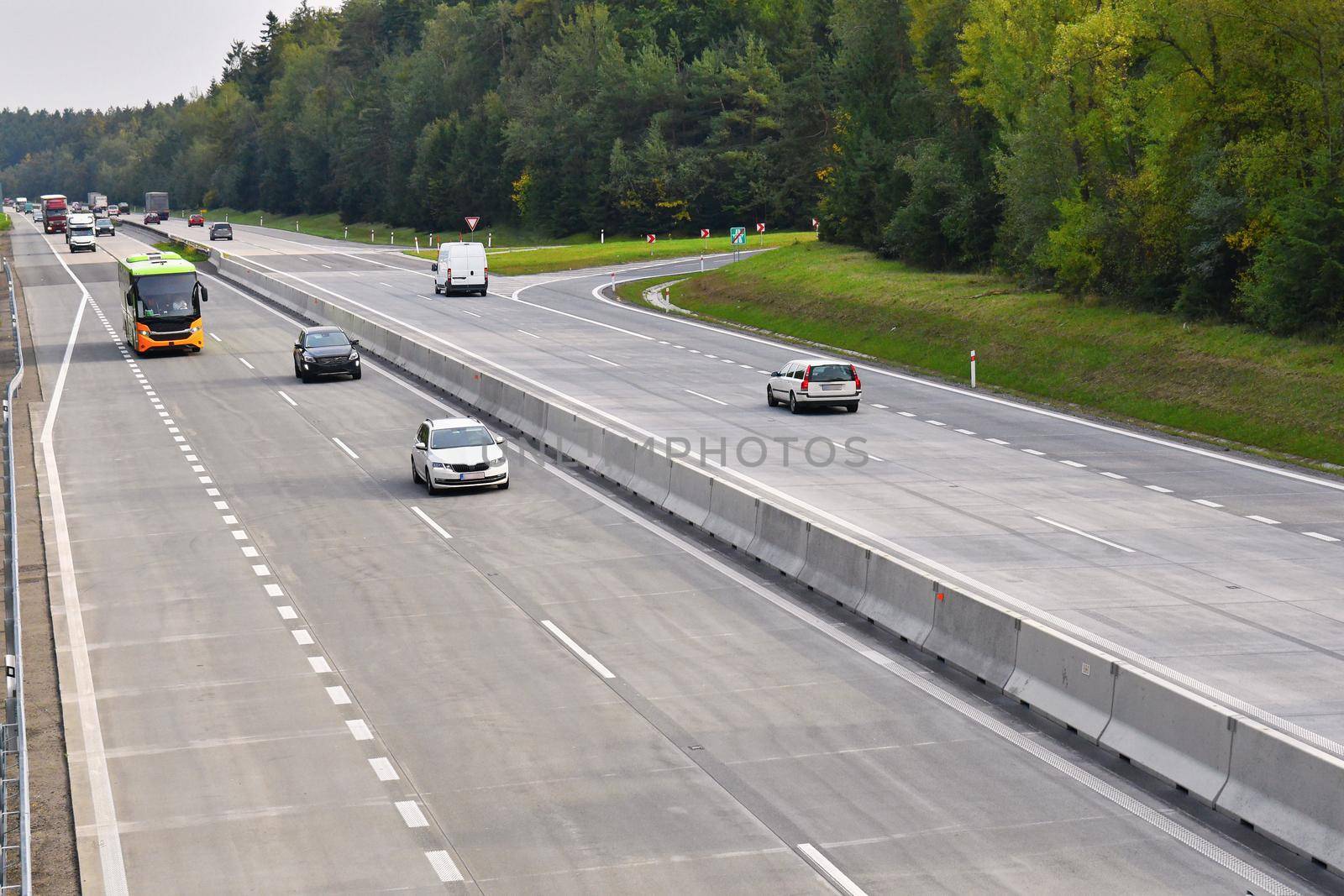 Cars on highway in traffic jam.  by Montypeter