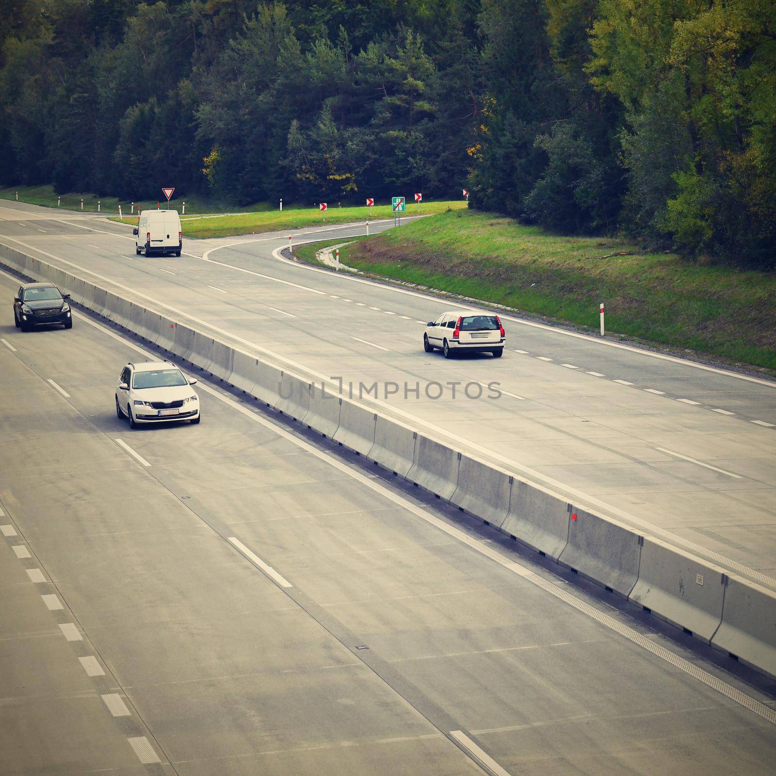 Cars on highway in traffic jam.  by Montypeter