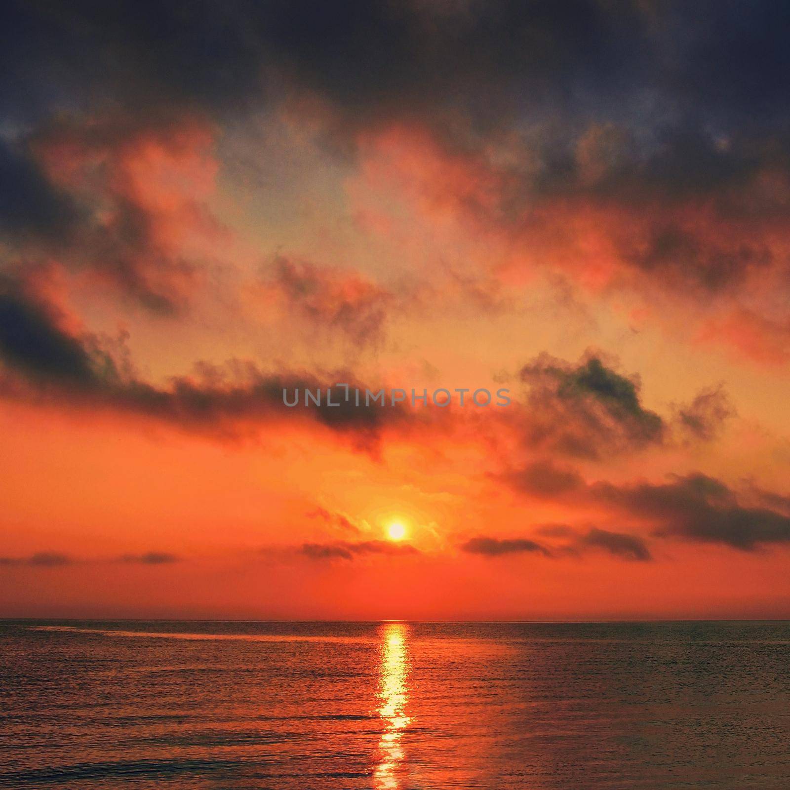 Beautiful sunrise-sunset by the sea at the beach. Romantic landscape, concept for summer.