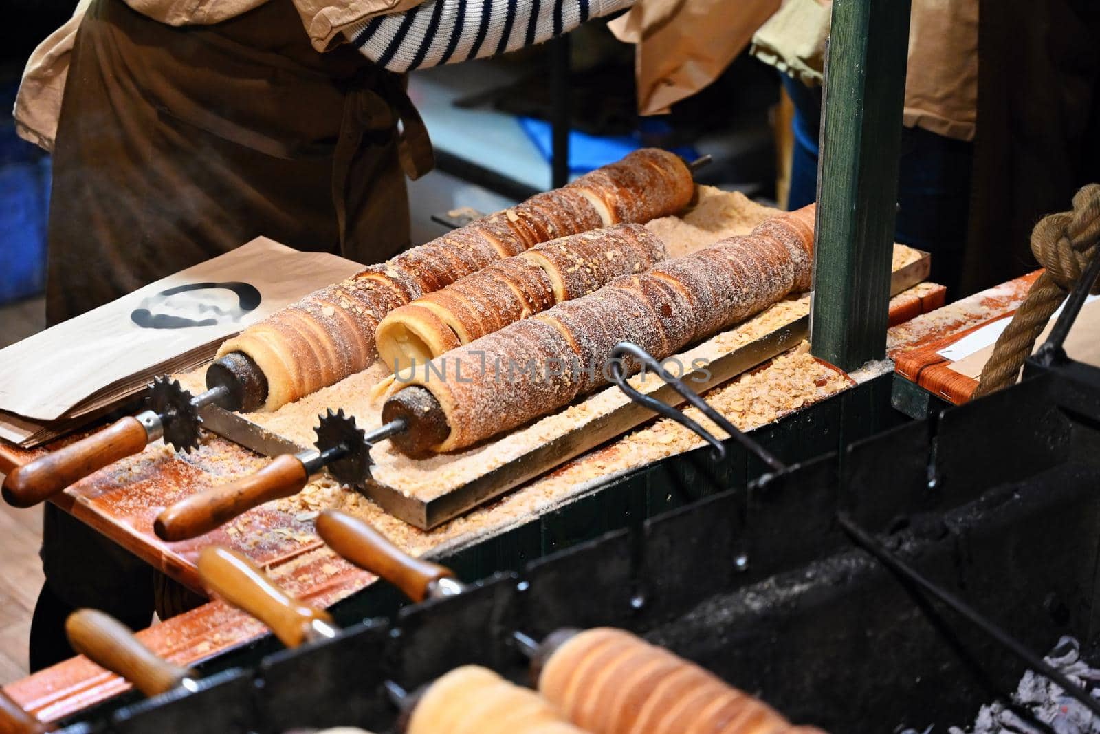 Close up of cooking the traditional sweet Czech pastry, trdelnik-trdlo.