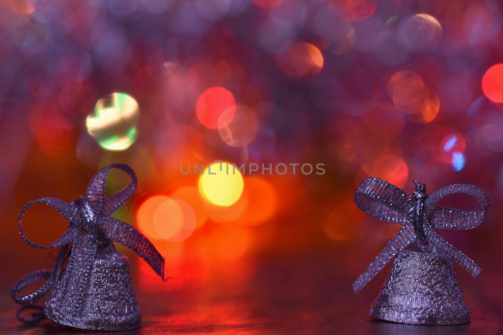 Christmas decorations. Beautiful Christmas tree ornaments on abstract, blurred colorful background. Concept for winter, holiday and snow. by Montypeter