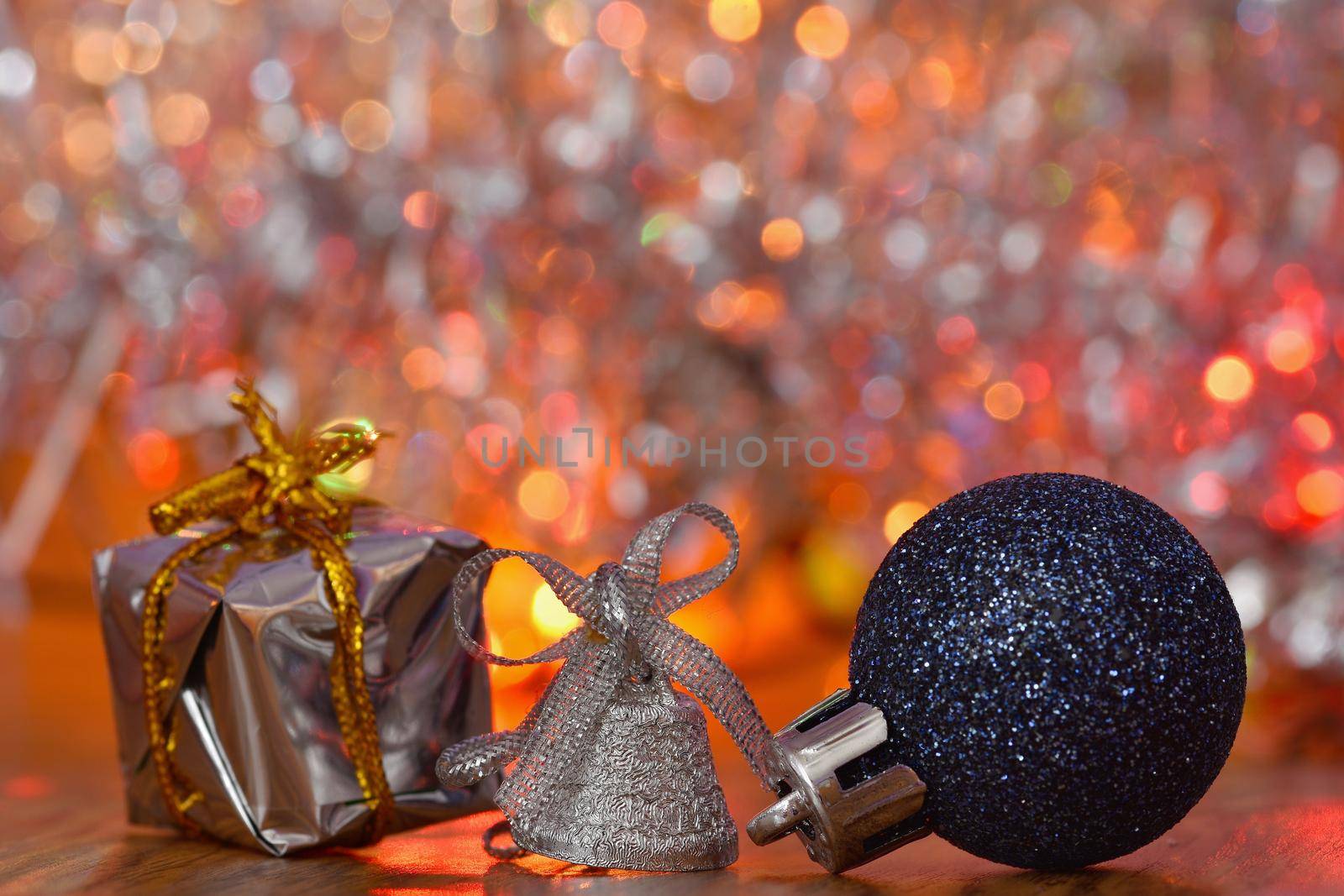 Christmas decorations. Beautiful Christmas tree ornaments on abstract, blurred colorful background. Concept for winter, holiday and snow.