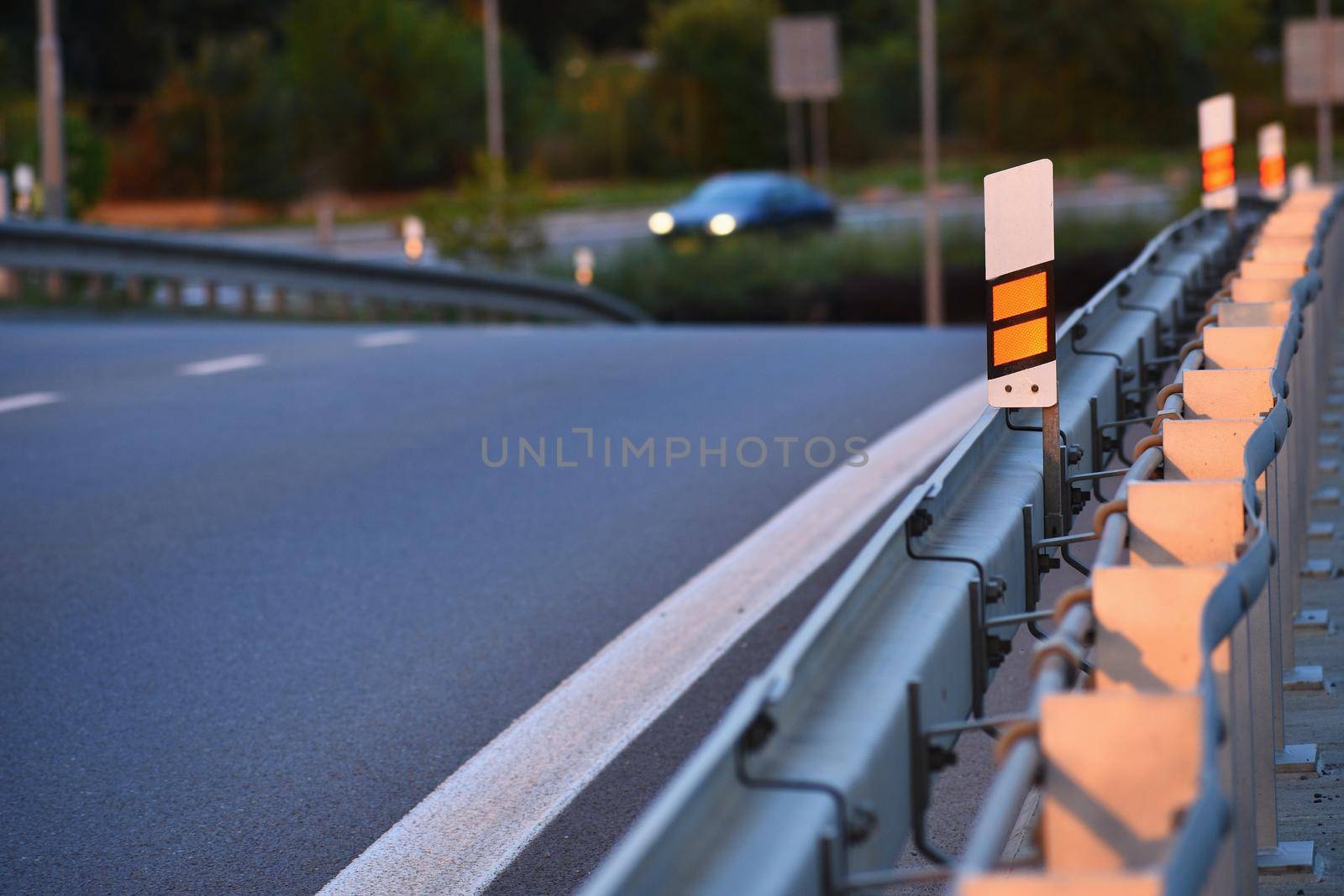 Morning on the road. Guard and car in the morning sun. by Montypeter