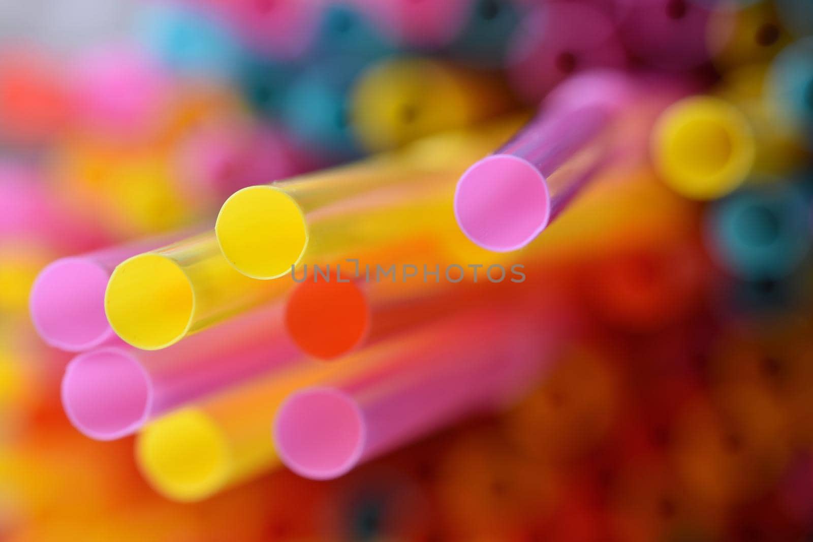 Drinking straws. Macro abstract image with beautiful multi-colored background. by Montypeter