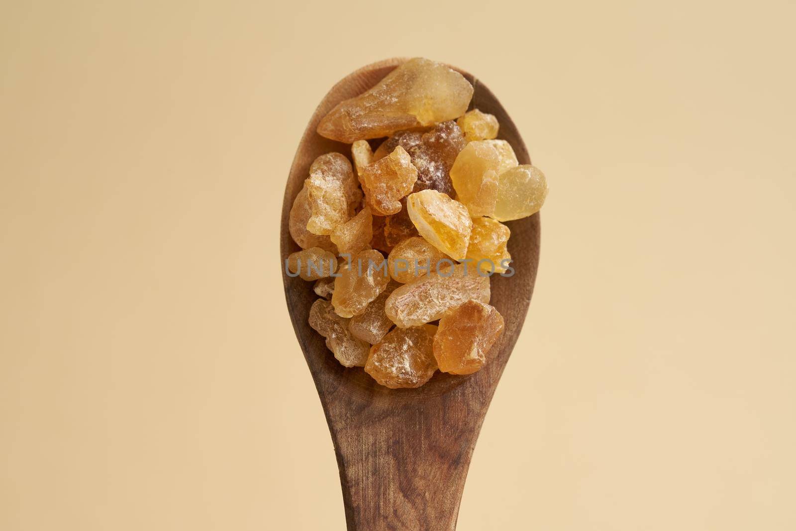 Frankincense resin crystals on a wooden spoon by madeleine_steinbach
