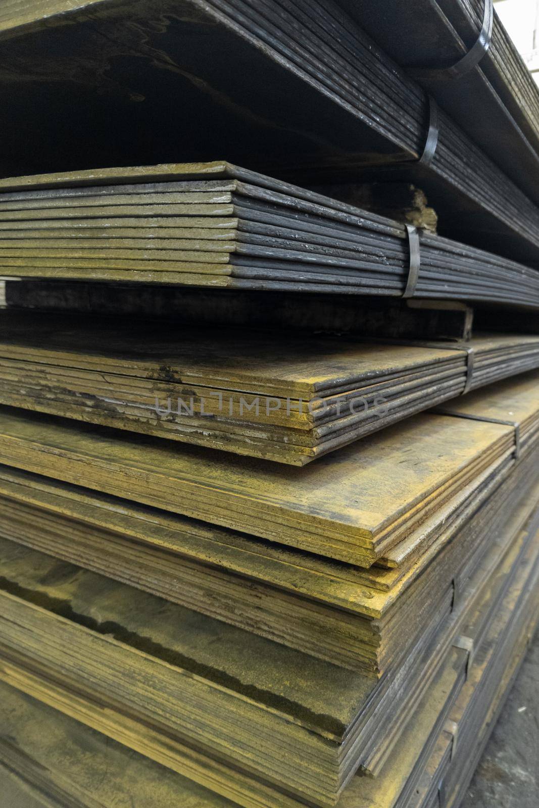 thick rusty hot rolled steel sheets stack corner, close-up.