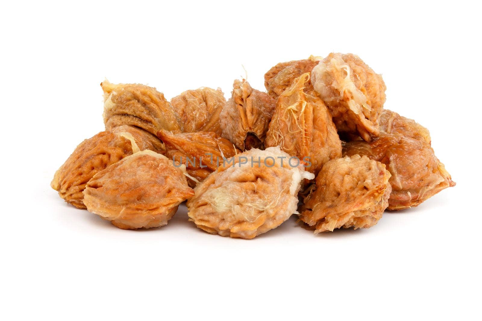 handful of wet peach seed with pulp leftovers isolated on white background