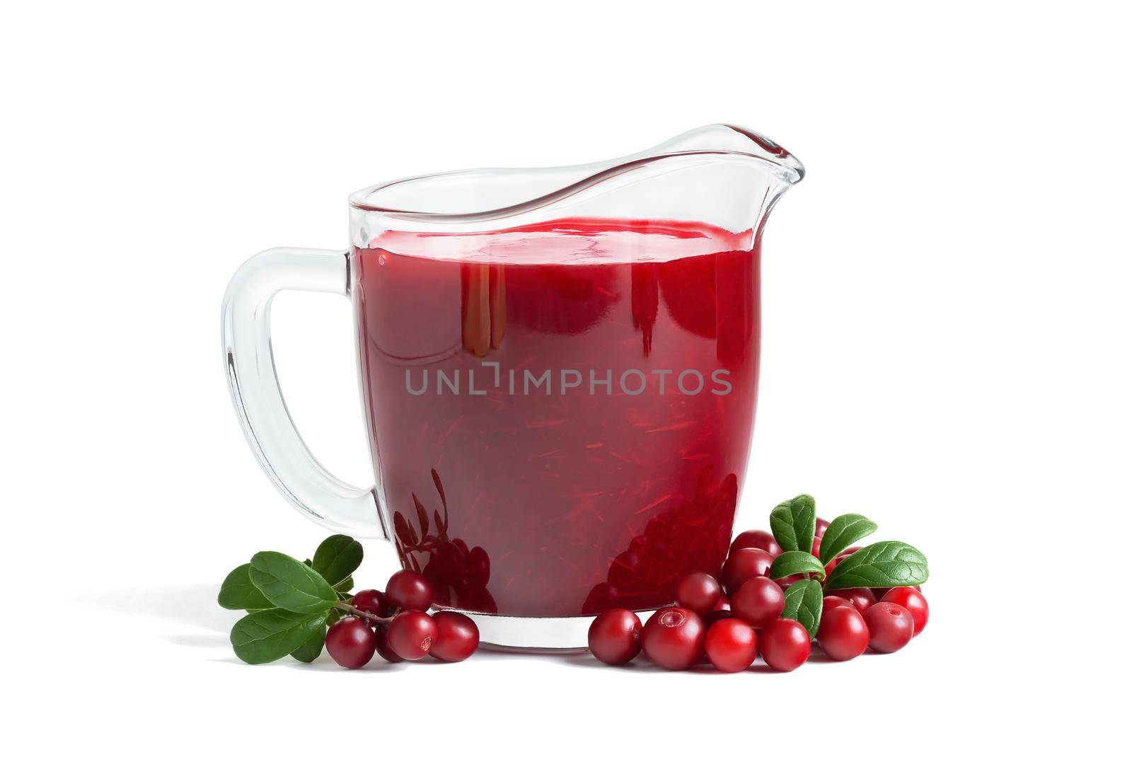 Homemade fresh wild lingonberry sauce in glass gravy boat isolated on white background by galsand