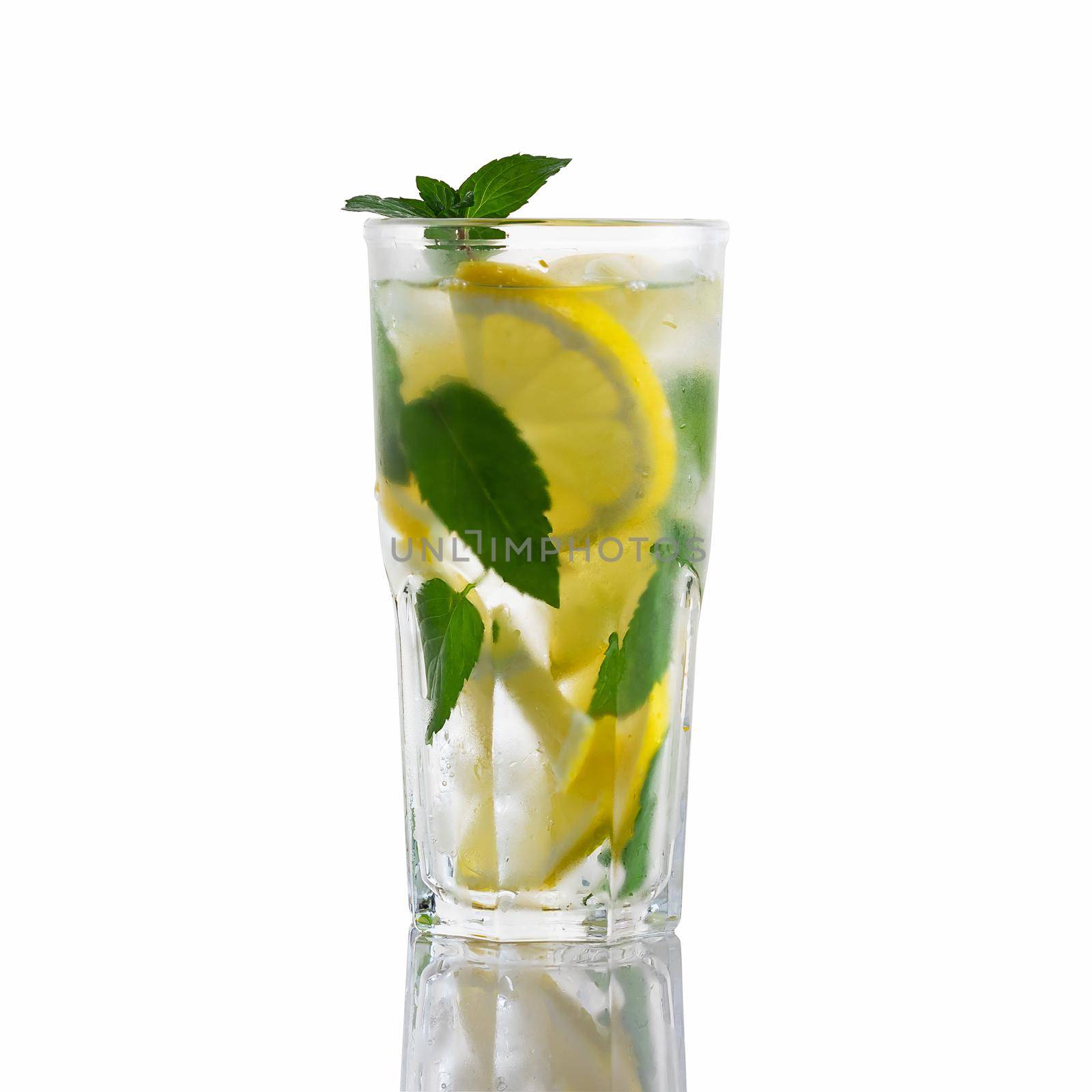 Fresh homemade cocktail in a tall glass with lemon, mint and ice isolated on white background.