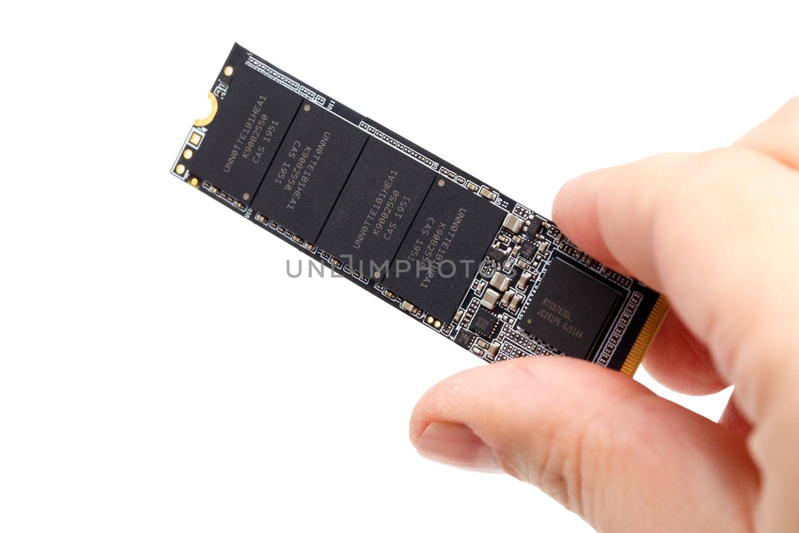 caucasian hand holding Non-Volatile Memory Next Generation Form Factor solid state drive 2280 3Dnand Single-Level Cell drive stick isolated on white background