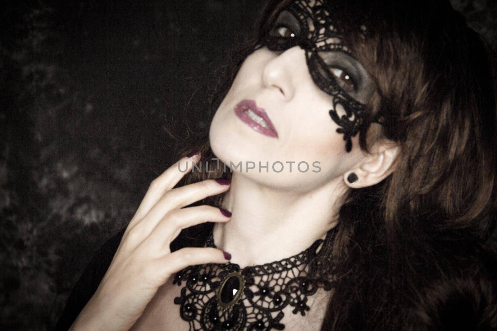 Woman disguised in gothic style for halloween party with mask