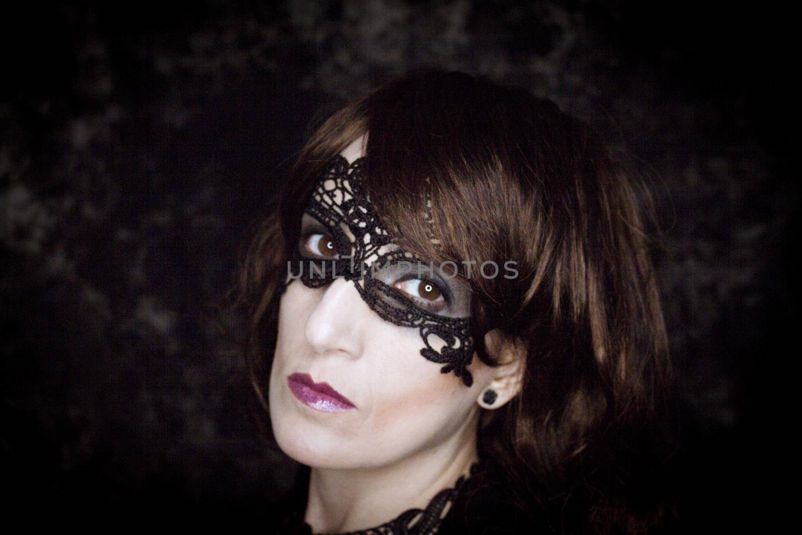 Woman disguised in gothic style for halloween party with mask