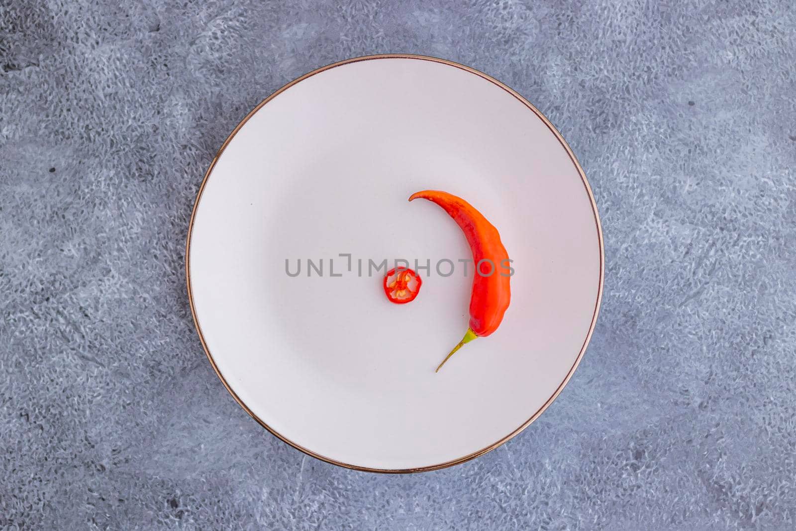 Presentation of the Peruvian red hot chili (Ají Limo) in a colored plate