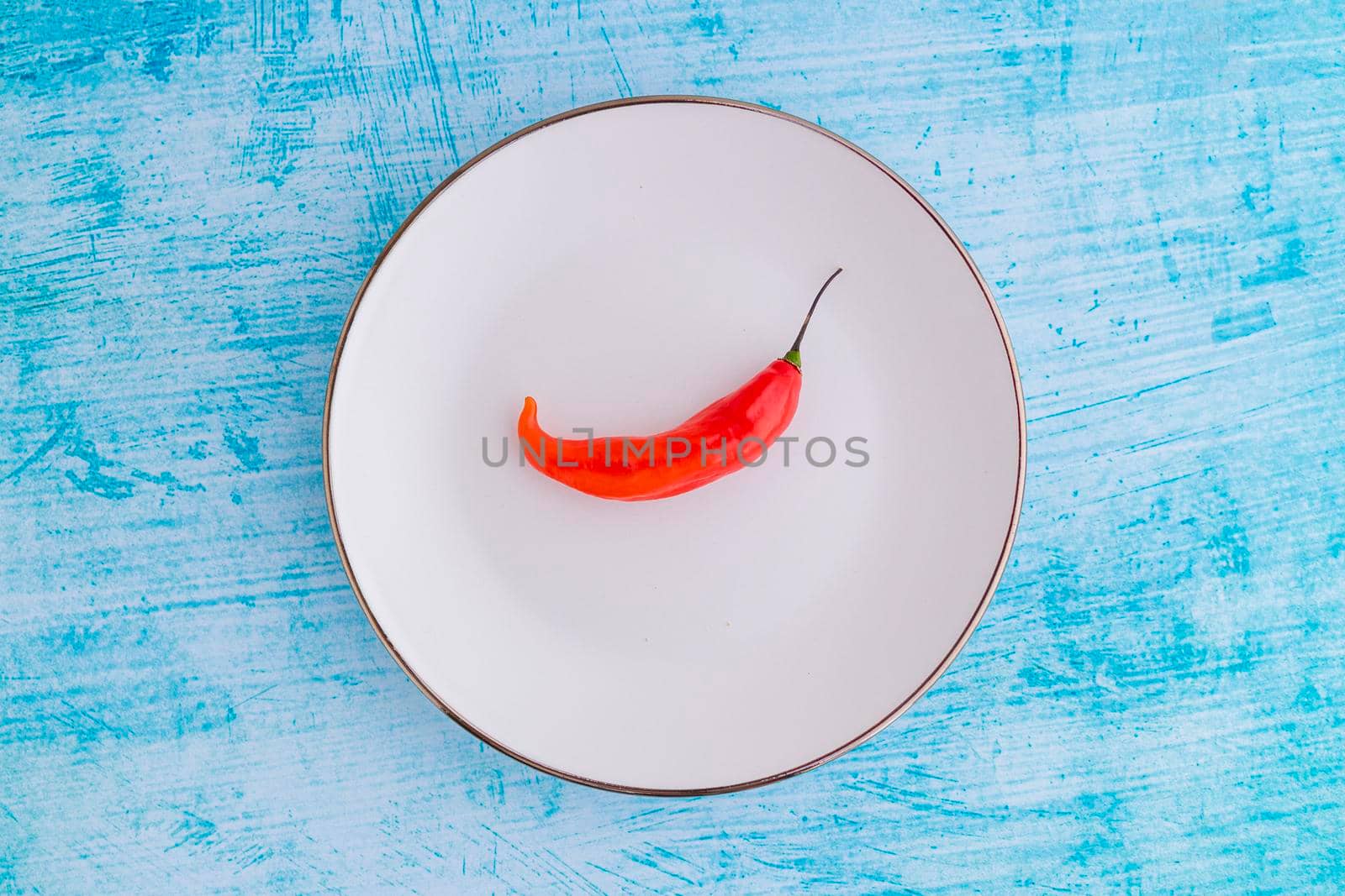 Presentation of the Peruvian red hot chili (Ají Limo) in a colored plate