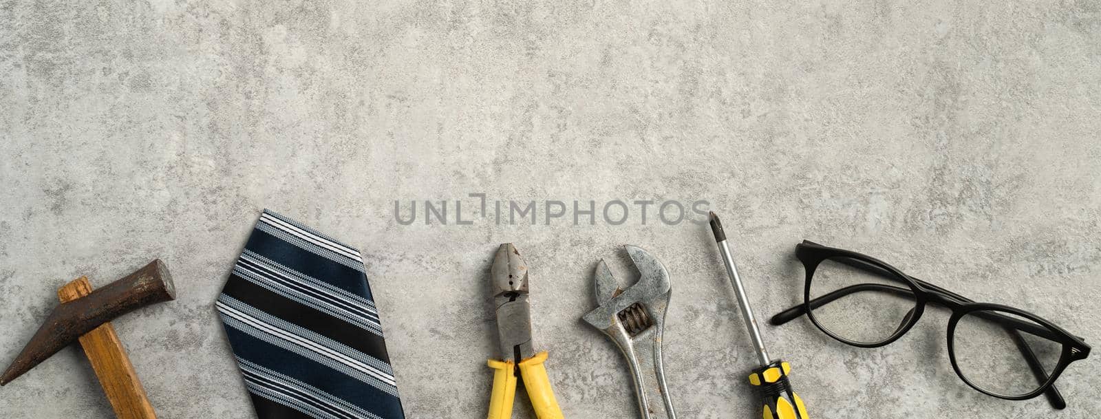 Top view design concept of Father's day and labor day with working tools on blue background.