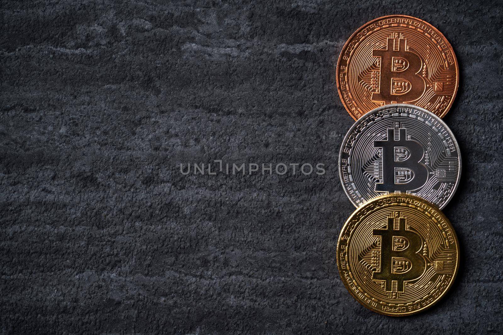 Bitcoin. Top view business cryptocurrency concept money on dark black slate table background.