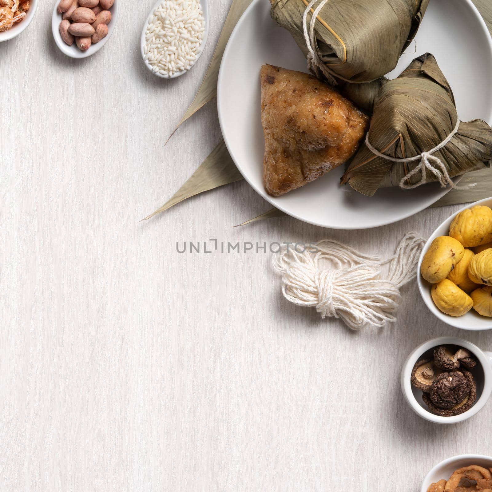 Zongzi. Delicious traditional rice dumpling food for Dragon Boat Duanwu Festival over wooden table background top view.
