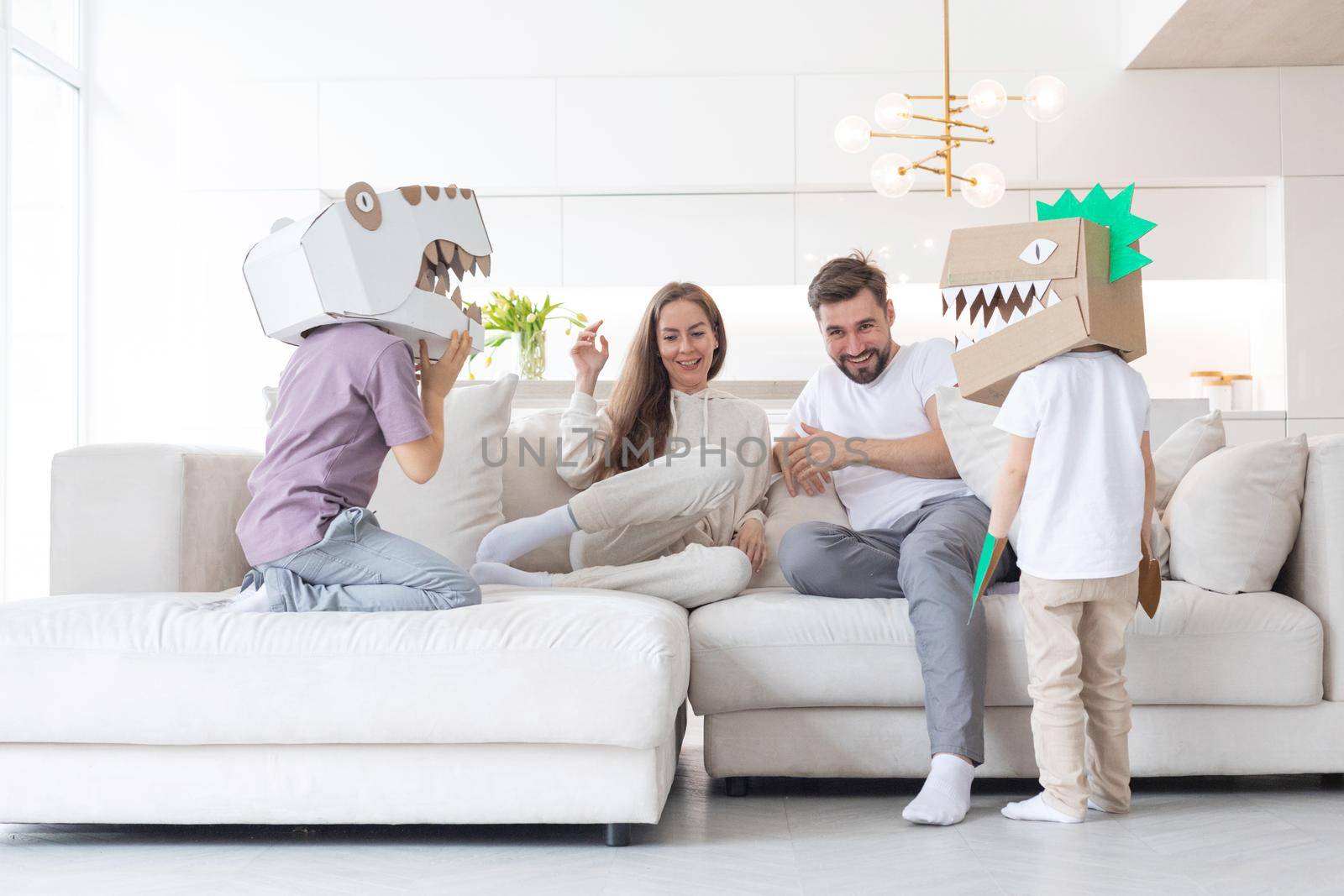 Family playing dinosaurs at home by ALotOfPeople