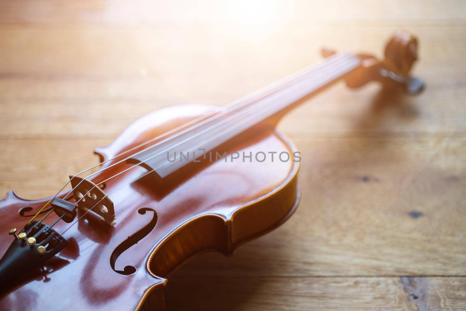 Violin music instrument concept: vintage style close up of violin by Daxenbichler