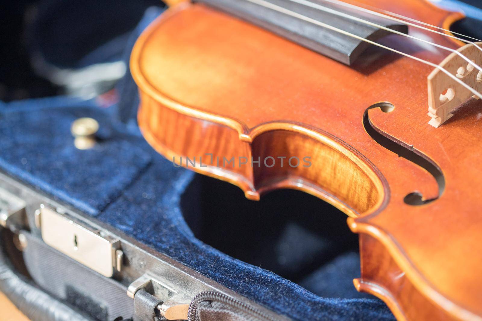 Violin music instrument concept: vintage style close up of violin by Daxenbichler