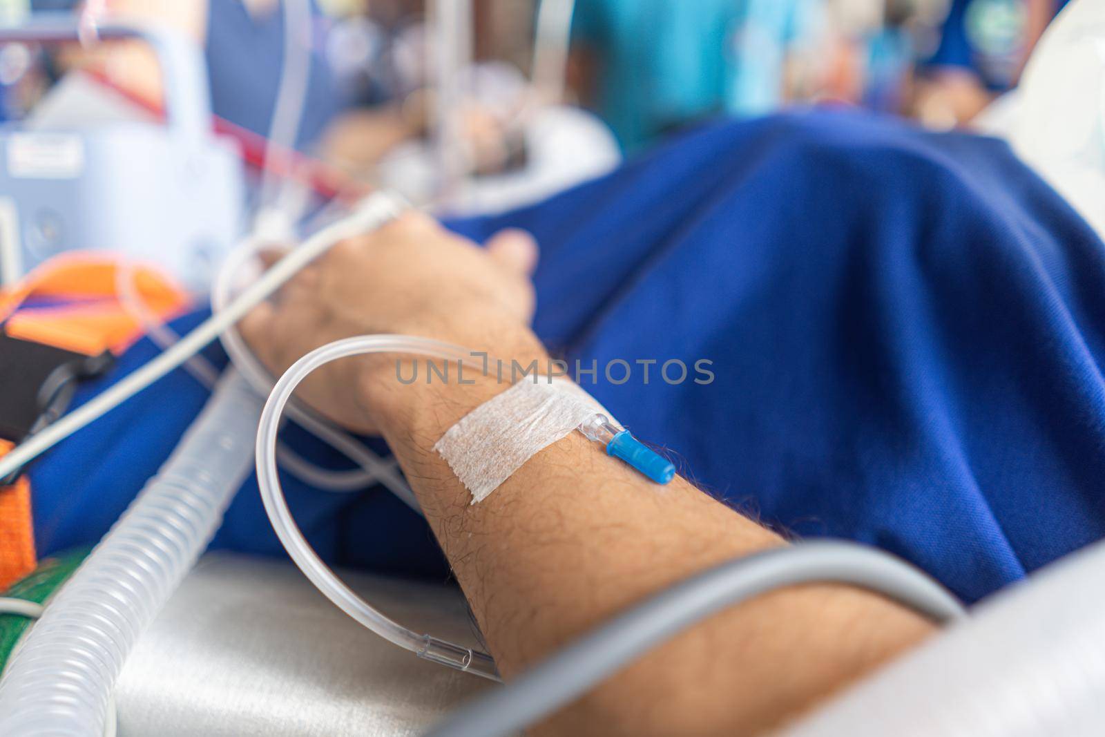 A close-up picture of a patient hand taking saline solution by sandyman