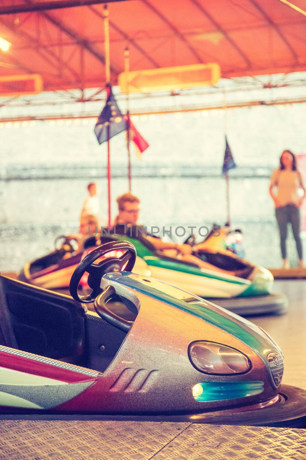 Bumper car at Oktoberfest: Colorful electric bumper car in autodrom by Daxenbichler